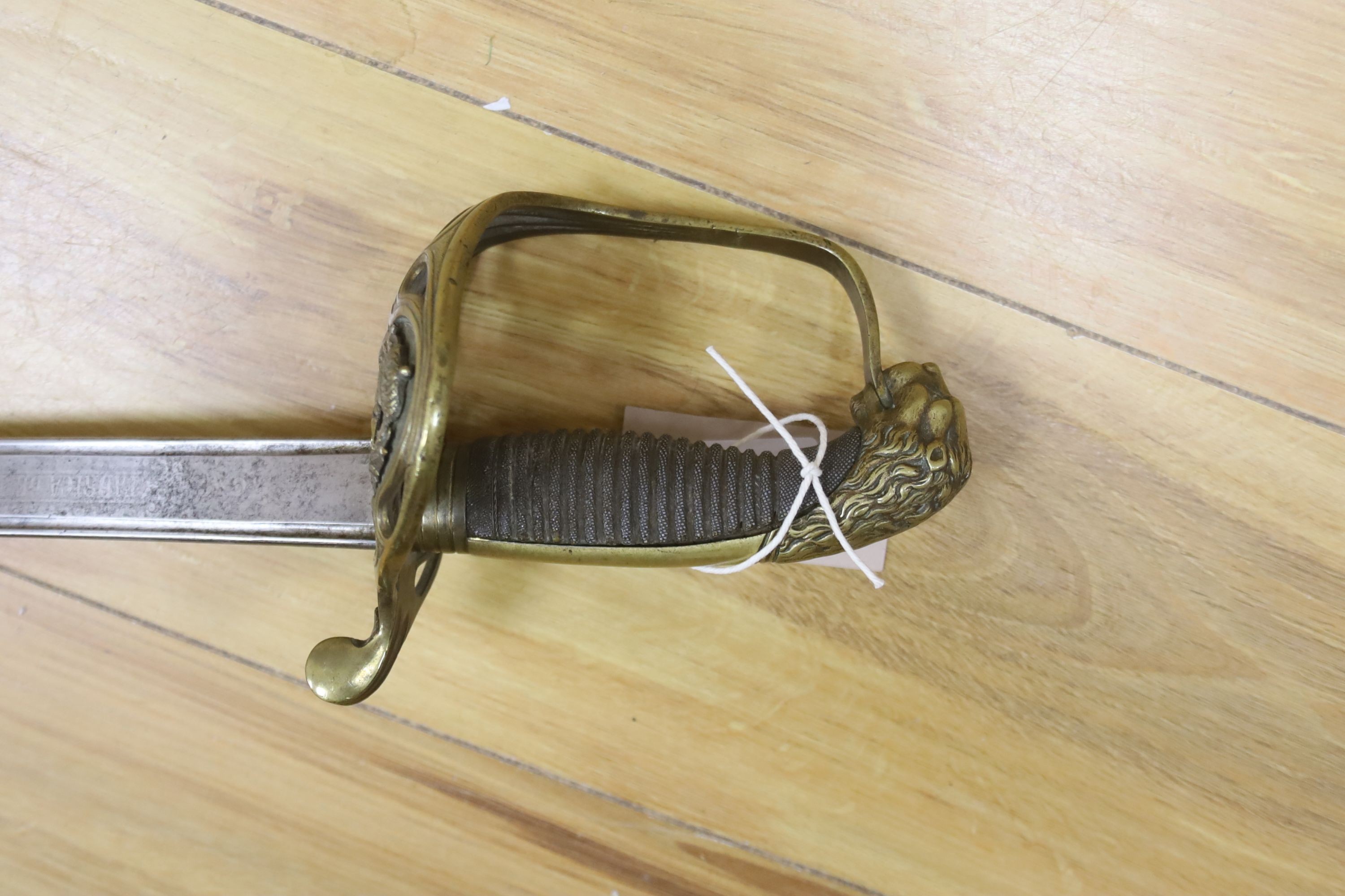 A Spanish officer's sword, dated 1873, the etched blade Fabrica de Toledo, total length 98cm